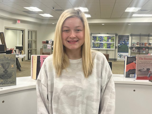A female student smiling at the camera.